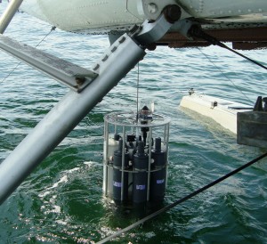 The department's monitoring flights lower a Sea-Bird CTD into Puget Sound (Credit: Washington Department of Ecology)