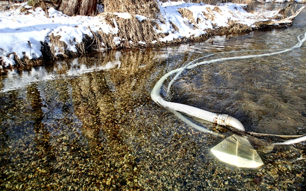 The Sand Wand is manually operated and selectively removes the silt and fine sand material while leaving the native cobble and gravel in place (Credit:  Fawn River Restoration and Conservation Charitable Trust)