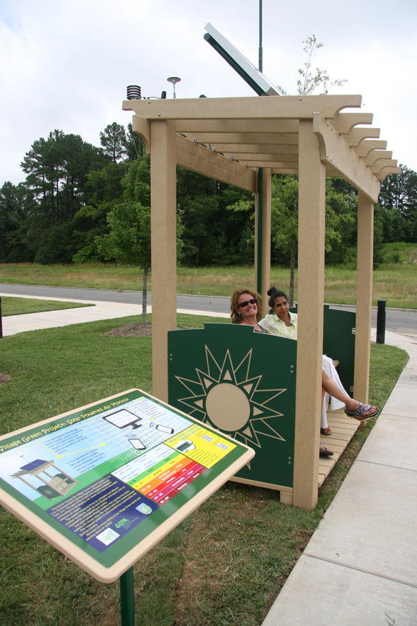 A trial version of the Village Green Project bench sits outside of the Durham County South Regional Library in Durham, N.C. (Credit: Gayle Hagler)