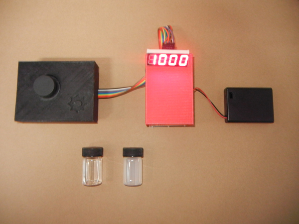 The turbidimeter's sensor and light source (left), circuit board and display panel (center), and battery case (right) will be combined into one case in the final model.