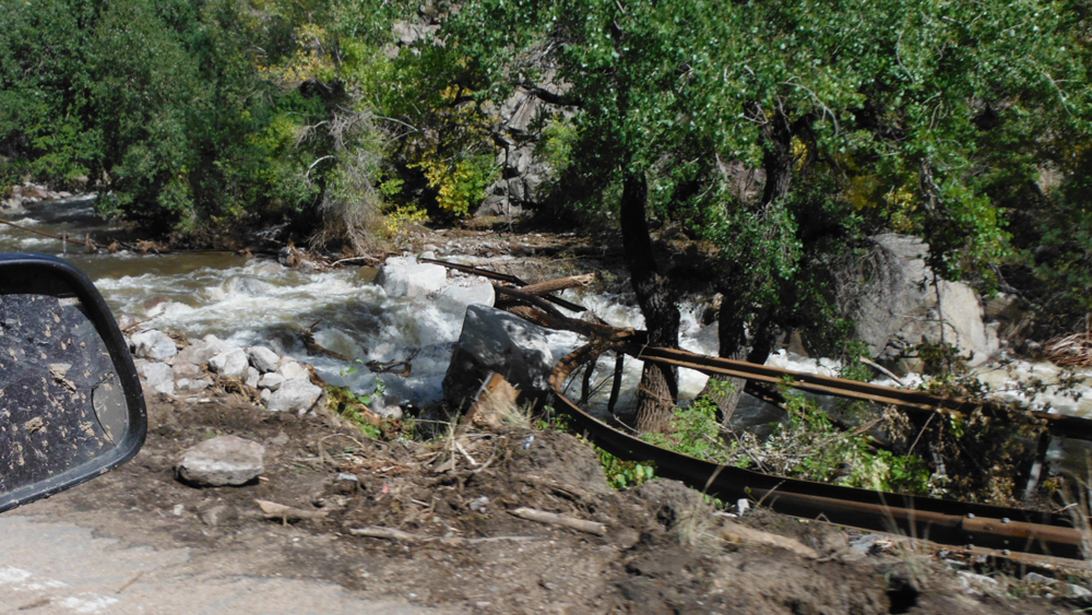 The flood pulled this guardrail out of the ground and strung it across Boulder Creek (Credit: Clayton Jensen)