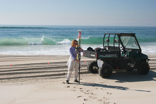 Hapke collects GPS data for beach profiles at Fire Island National Seashore (Credit: USGS)