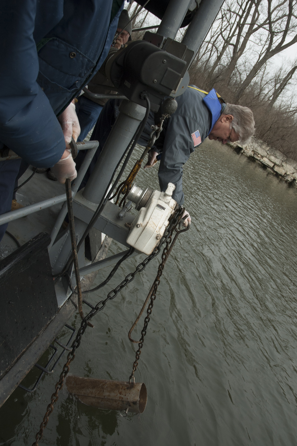 A MWRD pollution control technician collecting a dissolved oxygen sample from the patrol boat. (Credit: Metropolitan Water Reclamation District of Greater Chicago)