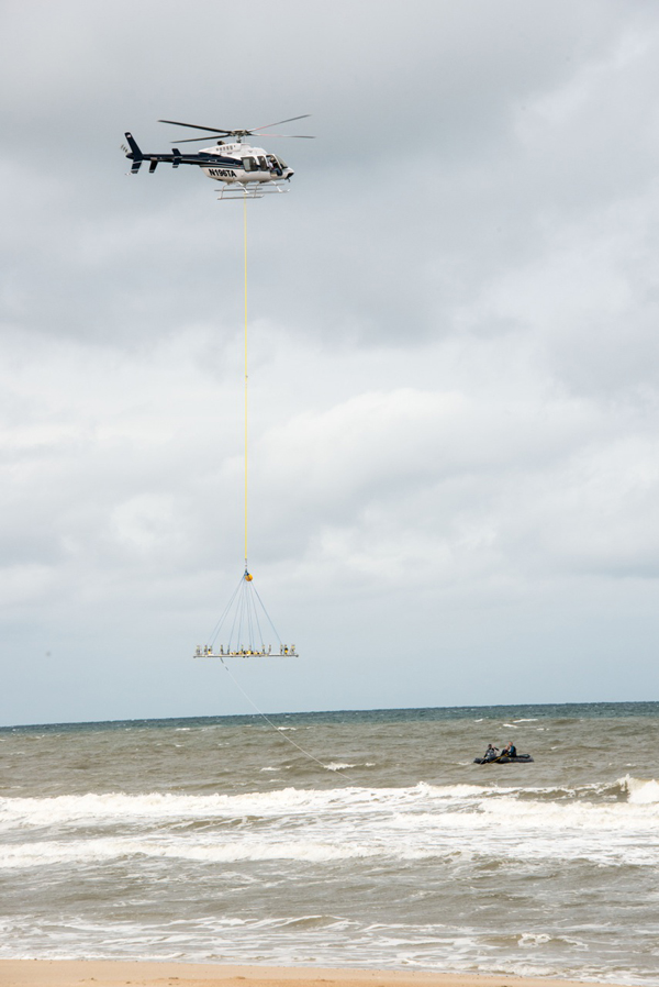 A helicopter placed the current ring in rough seas (Credit: WHOI)
