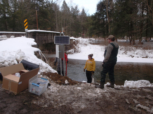 Working on a remote water quality monitoring station (Credit: Susquehanna River Basin Commission)