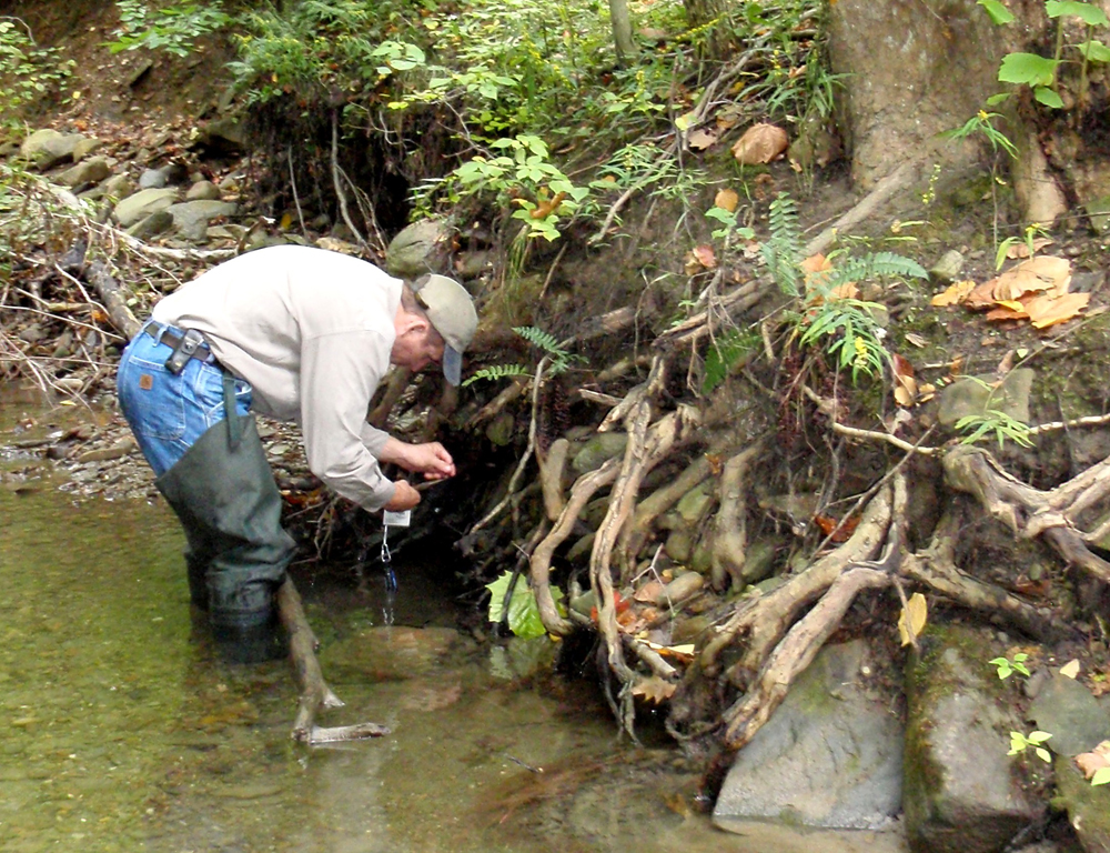 Installing temperature sensors that will help show whether the stream is suitable for Ohio brook trout (Credit: Cleveland Metroparks)