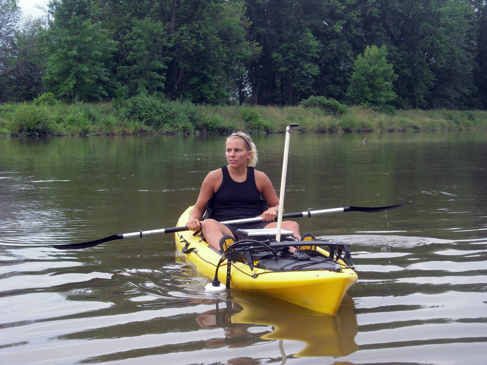 Aubrey Scott in her kayak equipped with flow-sensing instruments (Credit: Andrea Dominguez)