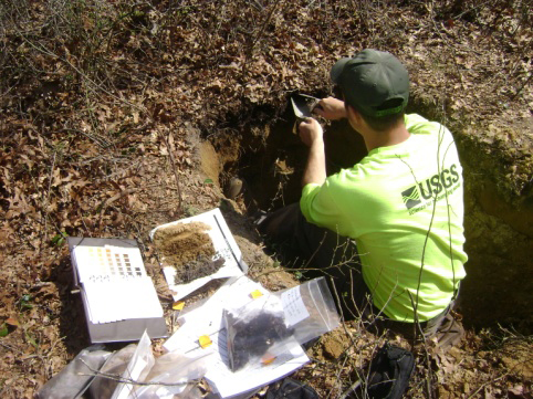 USGS scientist Jason Siemion sampling soils in Riverhead, N.Y. (Credit:Greg Lawrence)