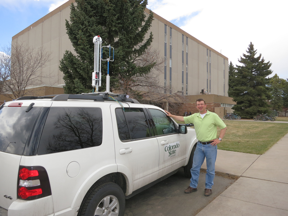  LI-7700 Open Path Methane Analyzer on top of research vehicle from Colorado State University as a part of LI-COR’s partnership with EDF, Google Earth, and CSU. Professor Joseph von Fischer (pictured) and Professor Jay Ham lead the measurements of methane escaping from pipes below city streets. (Credit: Joseph von Fischer)