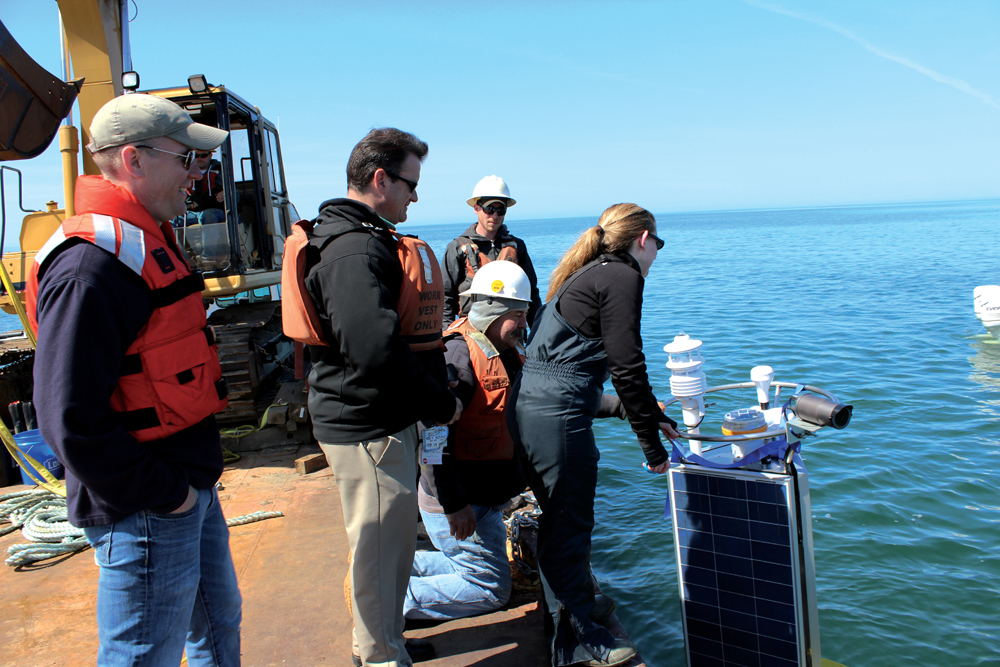 Jeanette Schnars cuts the ribbon at the buoy's first deployment in May (Credit: Doug Nguyen/NexSens Technology)