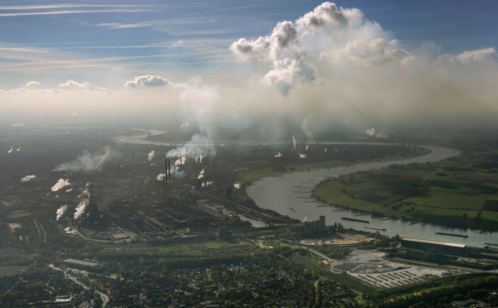 Air pollution over the Rhine where it flows through Westphalia, Germany, Europe