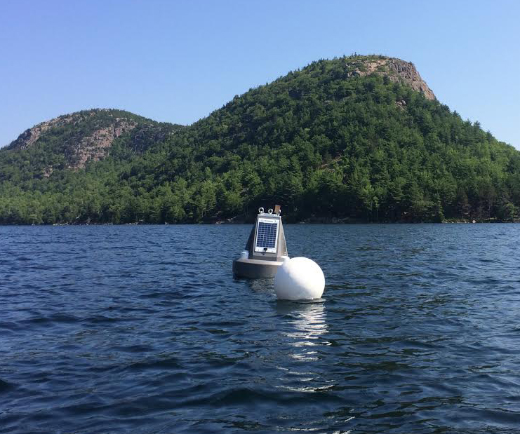 The Jordan Pond buoy floats near a few hills known locally as the "Bubbles." (Credit: Nora Theodore)