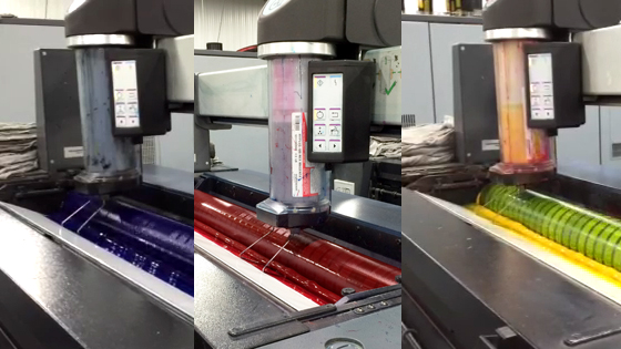 Cyan, magenta and yellow inks are layered on top of each other as the paper makes its way through the four color process. (Credit: Nate Christopher / Fondriest Environmental)