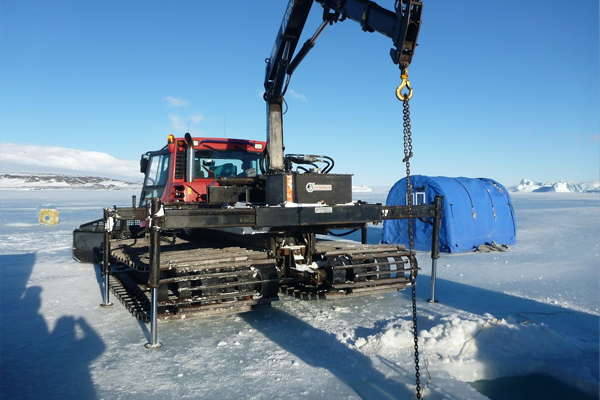 Researchers deployed the drone through holes they drilled in the ice. (Credit: Lars Chresten Lund-Hansen)