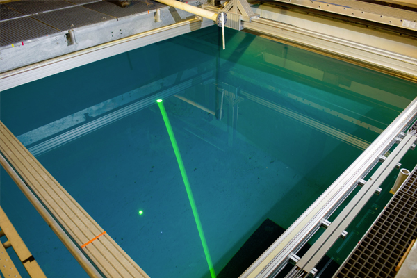 GTRI researchers use the lidar system to study the best methods for producing accurate images of objects on the pool floor. (Credit: Rob Felt)