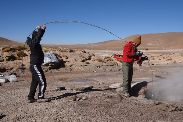 Researchers run temperature and pressure sensors down a geyser in Chile. (Credit: University of California, Berkeley)