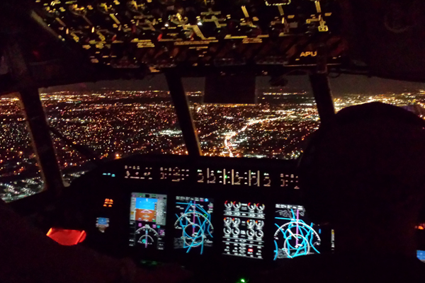 A view from the cockpit as scientists fly over Long Island to sample nighttime pollution from New York City. (Credit: Joel Thornton)