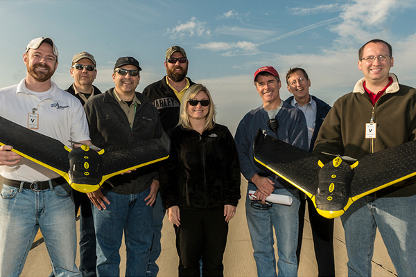 Scientists at the Wright State Research Institute display one of their UAS aircraft. (Credit: Wright State University)