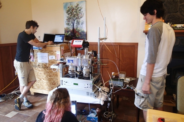 Students test out air monitoring equipment in a kitchen before deployment near Mount Kilauea. (Credit: Massachusetts Institute of Technology)