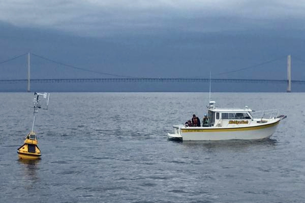 The R/V Agassiz pulls away after Michigan Tech / GLRC scientists deploy the new Straits of Mackinac buoy. (Credit: Enbridge)