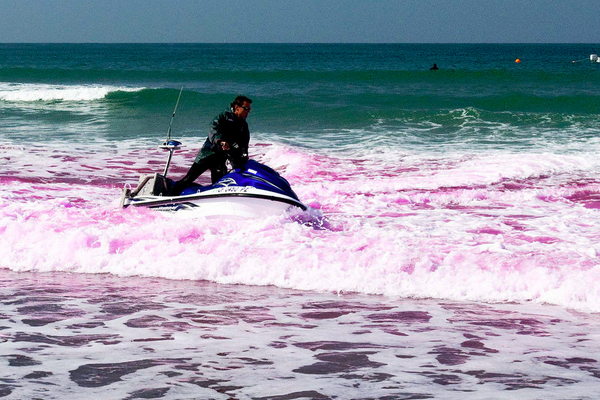 During the 2009 Imperial Beach Pollutant Transport and Dilution Experiment, a researcher uses a jet ski to track pink dye. This year’s Cross Surfzone / Inner-shelf Dye Exchange project will use the same method. (Credit: Scripps Institution of Oceanography)