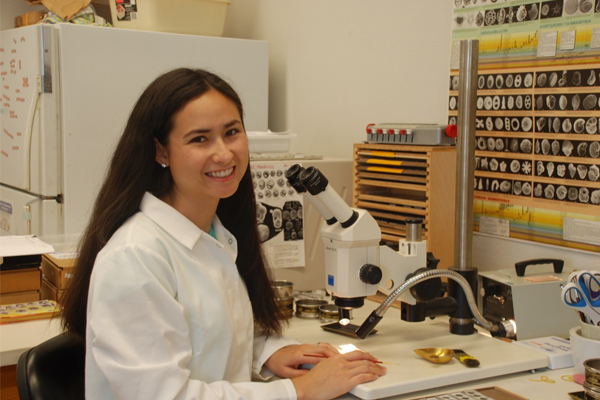 Karla Knudson working in the Stable Isotope Lab at University of California, Santa Cruz, looking at foraminifera species. (Credit: Sarah White)