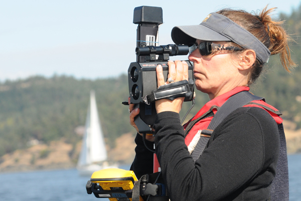 Deborah Giles of the University of California, Davis tracks nearby vessel traffic with a laser positioning system she developed. (Credit: National Oceanic and Atmospheric Administration)