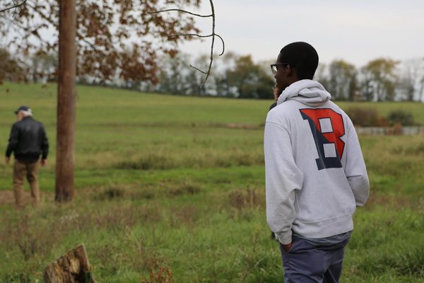 A Bucknell University student observes a farm field. (Credit: Bucknell University)