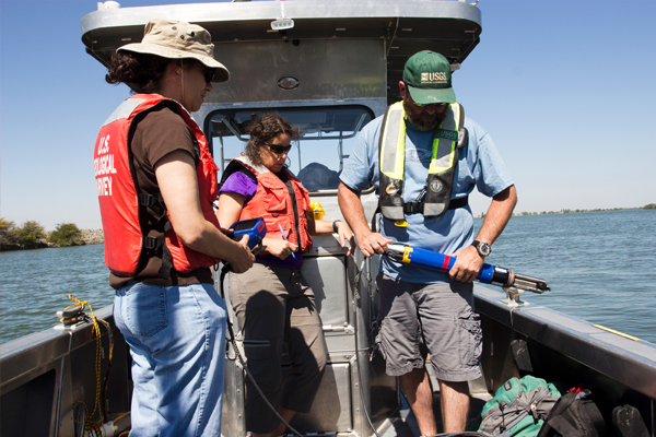U.S. Geological Survey scientists (from left) Judy Drexler, Tamara Kraus and Bryan Downing and Katy O’Donnell preparing to take spot field measurements in the San Francisco estuary. (Credit: Stephen de Ropp for the U.S. Geological Survey)