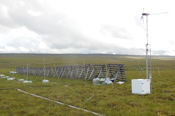 Snowfence experiment placed by Jeffrey Welker, part of the International Tundra Experiment. (Credit: Miquel Gonzalez-Meler)