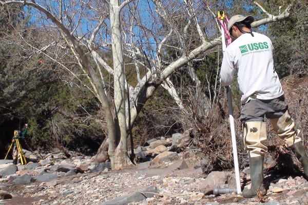 Hydrologists work to install continuous slope-area sensors on Sycamore Creek. (Credit: U.S. Geological Survey)