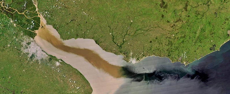 Sediment can be carried downstream by water flow. (Photo Credit: NASA Visible Earth, via USGS)