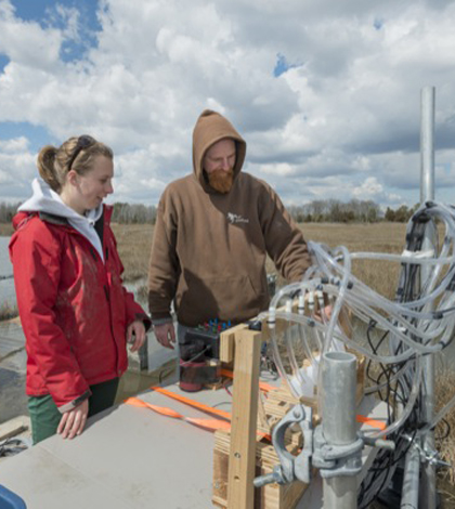Jack Puleo and graduate student Aline Pieterse conduct research in the Brockonbridge Marsh. (Credit: University of Delaware)