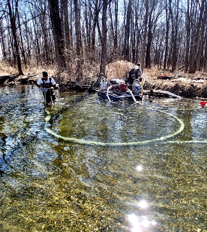 A Streamside Environmental crew works the Stream Wand over the Fawn River's gravel bed (Credit: Fawn River Restoration and Conservation Charitable Trust)