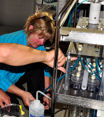 WHOI microbial ecologist Virginia Edgcomb, seen here working on a deep-sea robotic incubator (Credit: Cherie Winner, Woods Hole Oceanographic Institution)