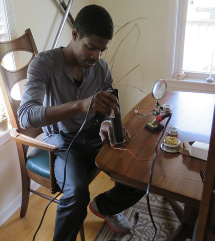 Kersey Sturdivant works with the components of a small CTD (Credit: Andrew Thaler)