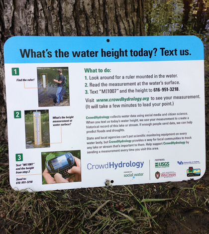 Signs at CrowdHydrology gauges instruct passersby to text water level data (Credit: Chris Lowry)