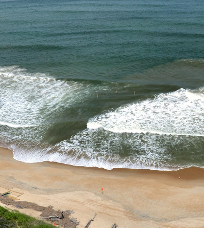 A rip current forms along trench dug with a military landing vehicle (Credit: Steve Elgar)