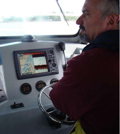 Donald Uzarski at the helm of the RV Chippewa