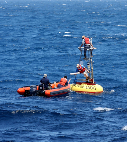 A crew works on the ocen mooring where the temperature sensors were deployed (Credit: Oregon State University)