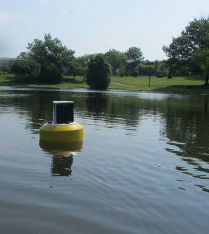 A data buoy floats on 'The Gunk' on the SUNY New Paltz campus