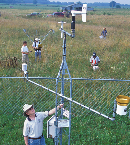 ARS hydrologist Tom Jackson and collaborators collect an array of ground observations to verify the accuracy of satellite data. (Credit: Stephen Ausmus)