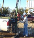 Nathan Nelson, associate professor in agronomy, collects deep soil samples with a direct-push hydraulic soil probe. (Credit: Jeanna Walters-Fancella)