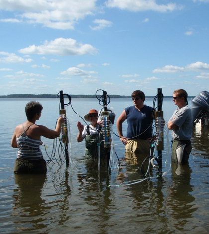 A Research team including Anderson takes field measurements on the New River Estuary (Credit: NOAA)