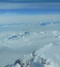A view of Antarctica’s ice sheet and mountains seen from a U.S. Air National Guard LC-130 aircraft during a flight to the South Pole in December 2012. (Credit: NASA/Christy Hansen)