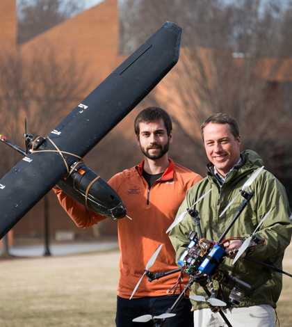 Max Messinger and biology professor Miles Silman with remote controlled helicopter and plane. (Credit: Wake Forest University)