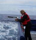 Jacquelyn Hams aboard the R/V Revelle in the Indian ocean with an XBT, a torpedo gun-like instrument for measuring ocean thermoclines