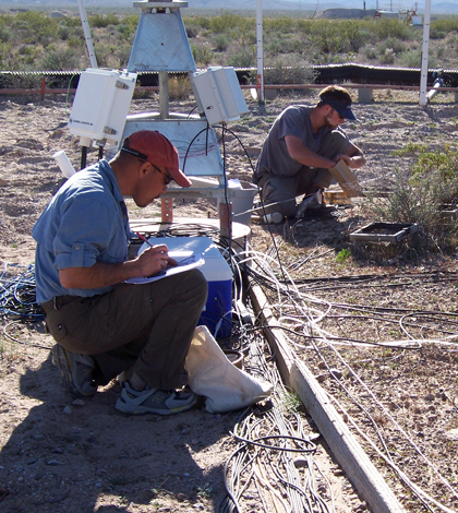 Researchers gather soil samples in a Mojave Desert test plot (Credit: Lynn Fenstermaker/Desert Research Institute)
