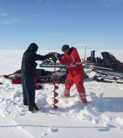 Sampling an Arctic lake (Credit: Ben Jones)