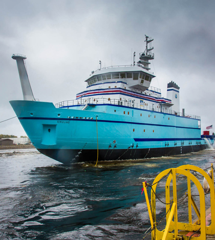 The 261-foot Sikuliaq rests in the water moments after its launch from a shipyard in Marinette, Wisc. (Credit: Todd Paris/UAF)